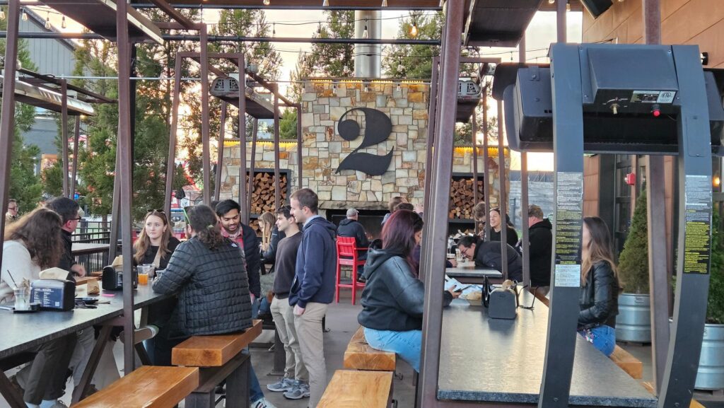 Outdoor social area at 2 Silos Brewing Co at NOVA Live Manassas