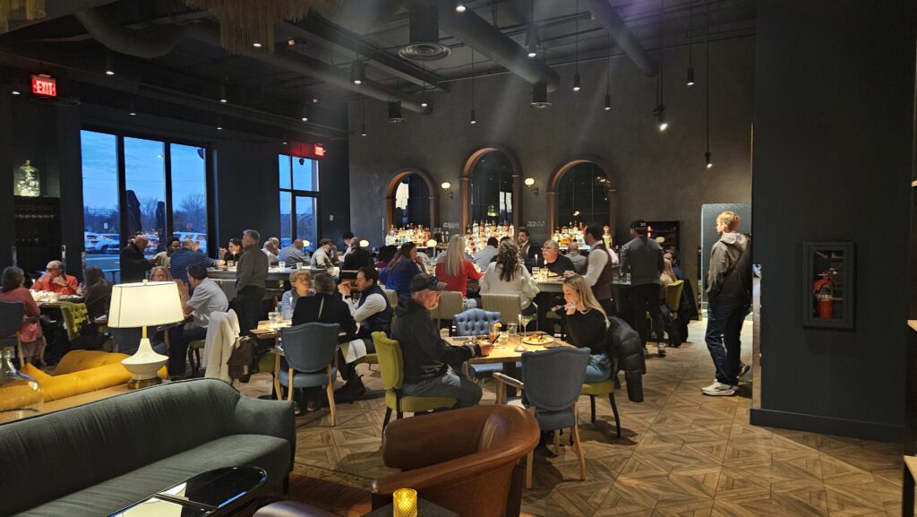 Interior dining and bar area at Proof Kitchen and Bar at NOVA Live Manassas